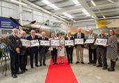 Mary Sheldon, the Mayor of Elmbridge (centre), and Tamalie Newbery, Brooklands Museum Director and CEO (far right) with Julian Temple, Brian Hennigan, Robbie Robinson, Bob Borchardt, Hilary Lomax, Ros Hennigan, Steve Lloyd, Ted Foster and Andy McMahon (left to right)